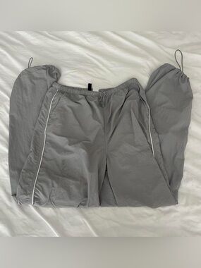 grey and white h&m divided parachute pants